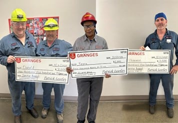 Gränges Americas employees holding up their service award.